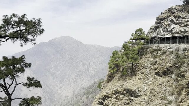 Cinematic footage capturing the spiritual journey and vibrant atmosphere of the Vaishno Devi pilgrimage in Katra, nestled in the scenic Trikuta Mountains of Jammu and Kashmir.