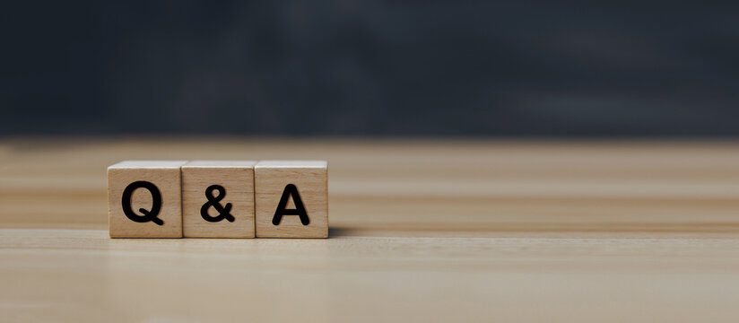 Contact Us. Q and A word on wooden block on desk, frequently asked questions, FAQ, problem solving, chatbot, job interview, solution helping, answer business, customer support service concept