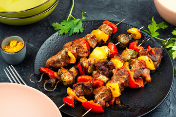 Skewers with grilled meat and vegetables.