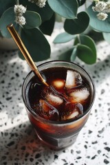 Iced Coffee in Glass with Gold Straw