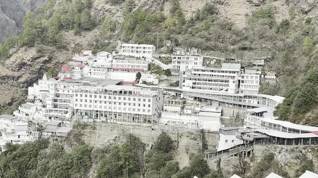 Cinematic footage capturing the spiritual journey and vibrant atmosphere of the Vaishno Devi pilgrimage in Katra, nestled in the scenic Trikuta Mountains of Jammu and Kashmir.