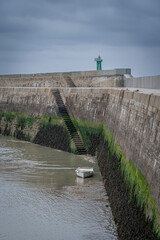 Port-en-Bessin-Huppain, France - 05 15 2025: Graphical view of the harbor, the pier stone...