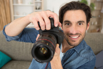 happy photographer working in his studio