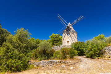Old windmill standing in the countryside of Saint Saturnin les Apt in Provence