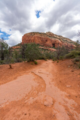 Sedona, Arizona, red rock formations and scenic landscapes under dramatic cloud-filled skies, capturing the natural beauty of the desert wilderness.