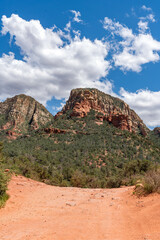 Sedona, Arizona, red rock formations and scenic landscapes under dramatic cloud-filled skies, capturing the natural beauty of the desert wilderness.