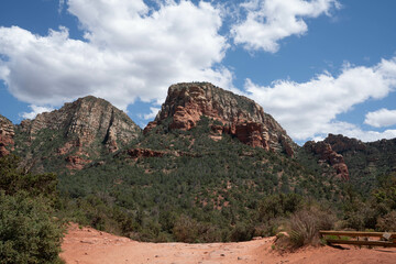 Sedona, Arizona, red rock formations and scenic landscapes under dramatic cloud-filled skies, capturing the natural beauty of the desert wilderness.