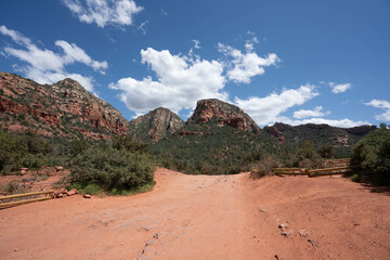 Sedona, Arizona, red rock formations and scenic landscapes under dramatic cloud-filled skies, capturing the natural beauty of the desert wilderness.