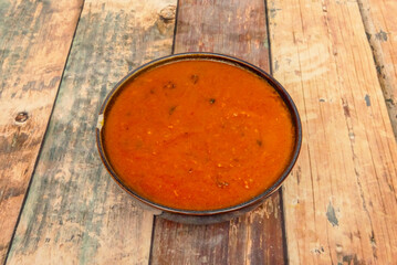 Rogan Josh: Lamb cooked in a deep red sauce, rich in spices, often with yogurt.