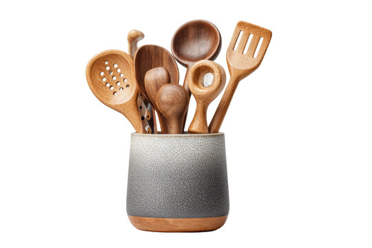 PNG Assorted wooden kitchen utensils in a ceramic holder on black background