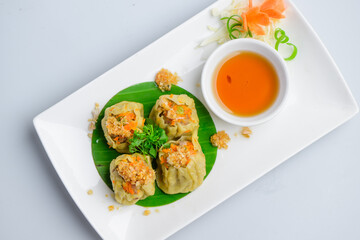 Traditional Steamed Shumai Dumplings with Dipping Sauce