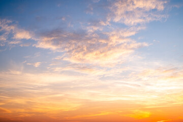 Beautiful luxury soft gradient with orange gold clouds and sunlight on the blue sky perfect for the background, take in everning,morning,Twilight, high definition landscape photo