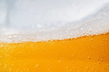 Close up bright orange Oil or beer splash texture and nature waves, Beautiful waves curve and...