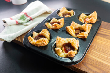 Sugar Plum Cheese Danish. Puff pastry with plum jam and cinnamon. Dessert. Food