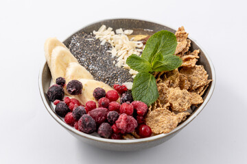 Healthy Breakfast Bowl: Chia Seeds, Berries, Banana, Cereal Flakes, Almonds and Mint. Nutritious Superfood Meal. Diet, Lifestyle, and Food Blogs