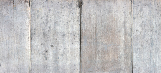 Fair faced concrete with a smooth, fine pored surface. The concrete surface has a subtle, even grain with slight formwork imprints and gentle color gradients in shades of grey and concrete.