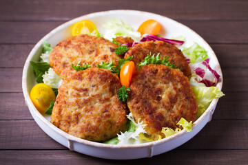 Fish cakes with vegetables and mashed potatoes. Fish patties or burgers