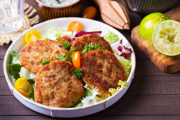Fish cakes with vegetables and mashed potatoes. Fish patties or burgers