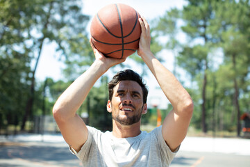 portrait of a basketball player taking a jump shot