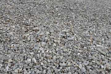 Rough gravel surface texture made of broken rocks and stones – seamless natural construction background