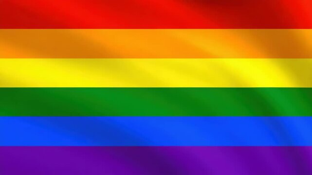 Rainbow flag waving, representing lgbtq plus pride, diversity, and ongoing pursuit of equal rights.