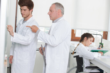 scientific researcher writing a chemistry formula