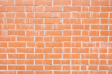 Modern orange brick wall with white mortar lines