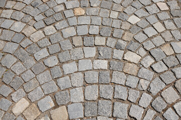 Old stone pavement with irregular granite blocks