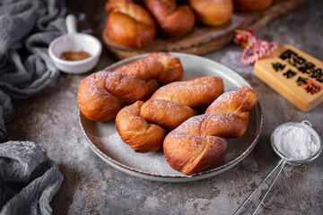 Korean donuts for breakfast. Home cooking. Sweet Korean donuts on a grey plate for dessert. Close-up