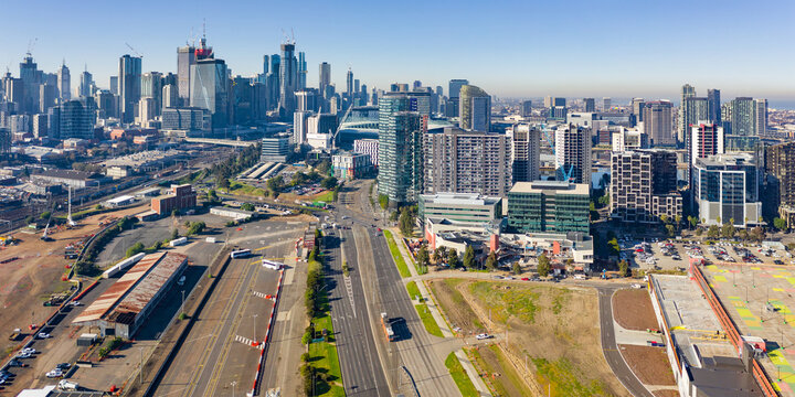 Aerial panorama of traffic on freeways leading into highrise city skyline