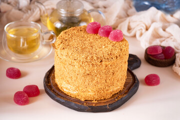 Homemade cake with honey and vanilla cream. A delicious dessert for the holiday. A birthday cake. Close-up