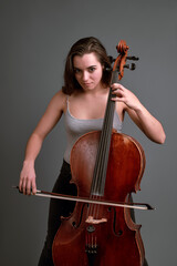 Young musician playing cello with passion and skill