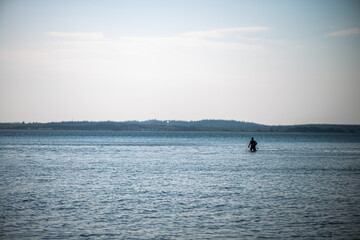 Obraz premium Fisherman Returning from the Sea with Spears and Fishing Nets