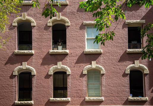 Windows with sandstone lintels and arches