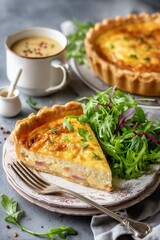 Quiche Lorraine slice on a vintage plate with a fresh green salad and Dijon vinaigrette on the side.