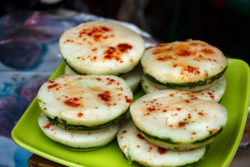 Traditional Bengali Pitha Sweets with Rice Flour, Coconut, and Nalen Gur