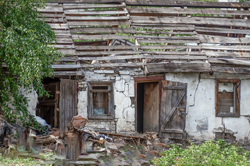 An abandoned village house on a summer day