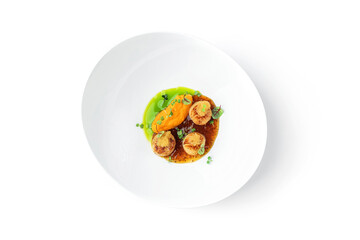 Fried scallops with fish caviar and sauce on plate isolated on white background. Seafood, close up, top view