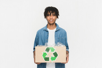 Adorable young african man guy male student eco activist holding a box with plastic bottles for...