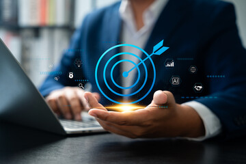 Businessman holding goal icon represent strategic planning, Success. Teamwork, Business strategy, Growth, Marketing focus, Investment planning, Leadership mindset aimed at achieving long-term success.