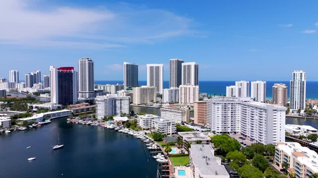 Aerial reveal highrise buildings Hallandale Beach with ocean views