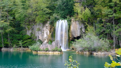 Isolated waterfall in forest cliff
