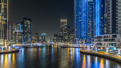 Obraz premium Dubai Marina towers and canal in Dubai night timelapse hyperlapse