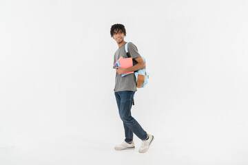 Full body side view young smiling happy man student wear casual clothes backpack bag hold books...