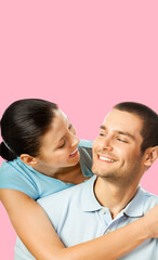 Portrait vertical image - smile cute young couple boyfriend girlfriend, beautiful woman, man in blue denim shirt, isolated rose pink background. Happy love concept. Dental care. Banner with free space