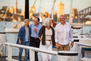 Senior couples walking on the pier at Sydney harbour
