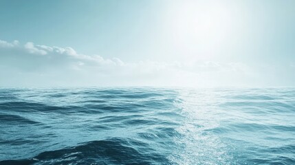 Fototapeta premium Serene Ocean Horizon Under Bright Sunlight with Gentle Waves and Soft Clouds Above