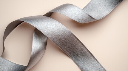 Elegant silver ribbon twisting and turning, creating a luxurious and stylish aesthetic.