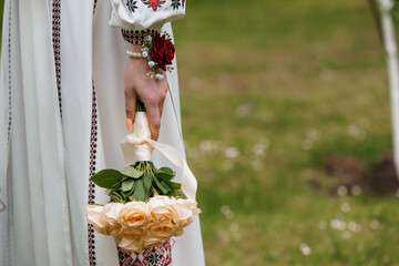 Ukrainian Bride Holding Peach Rose Bouquet, Traditional Vyshyvanka Embroidery, Outdoor Wedding...