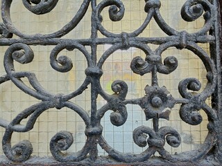 Rusty gate, wrought iron pattern.